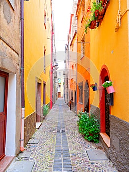 View of the beautiful, colorful, narrow street in Bosa. province of Oristano, Sardinia,