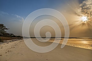 View of a beautiful deserted beach in the island of Orango at sunset, in Guinea Bissau.