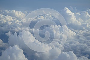 View of beautiful free form white cloud as per imagination with shades of blue sky background from flying plane window