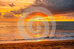 View of Beautiful glorious golden sunset and golden hour above the sea in evening