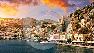 View of the beautiful greek island of Symi Simi with colourful houses and small boats. Greece, Symi island, view of the town of