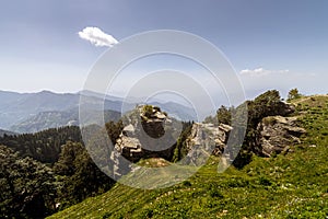 View of beautiful green scenery and mountain ridges at Hatu Peak of Narkanda town, Himachal Pradesh.