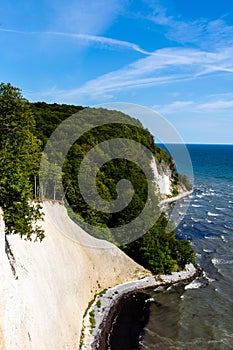 View of the beautiful lime and chalkstone cliffs in Jasmund National Park on Ruegen Island in Germany photo