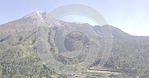 View of beautiful Merapi Mountain with the village below it in Yogyakarta, Indonesia