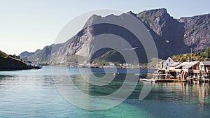 View of the beautiful Norwegian village with red houses on the water