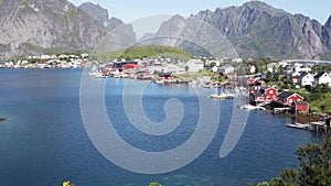 View of the beautiful Norwegian village with red houses on the water