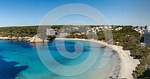 view of the beautiful sandy beach and seaside resort of Cala Galdana on Menorca island in Spain photo