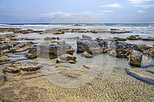 A view of a beautiful sea view in Ayia Thekla in Ayia Napa, Cyprus.Reflections, waves, cloudy day