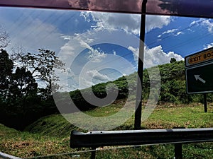 View of beautiful skies from moving car