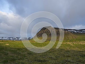 View on beautiful snow covered cliffs mountain and hills in Fljotavik cove, Hornstrandir, west fjords, Iceland, photo