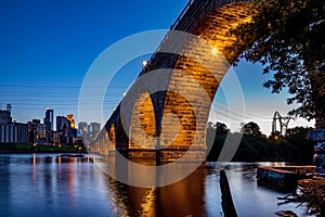 A view of the beautiful stone arch bridge of Minneapolis, MN, USA at dusk