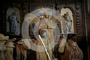 view of a beautiful straw nativity scene inside a church at Christmas