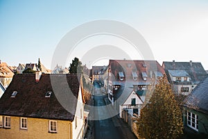 View of a beautiful street with traditional German houses in Rothenburg ob der Tauber in Germany. European city.