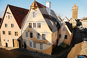 View of a beautiful street with traditional German houses in Rothenburg ob der Tauber in Germany. European city.