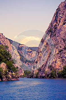 View of beautiful tourist attraction, the idyllic Matka Lake  at Matka Canyon in the Skopje surroundings at sunrise. Macedonia