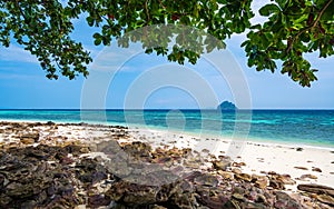 View of beautiful tropic beach at Ko Phi Phi islands, Thailand. White sand with green forest, palms and turquoise water. Summer