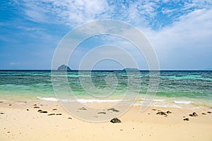 View of beautiful tropic beach at Ko Phi Phi islands, Thailand. White sand with green forest, palms and turquoise water. Summer