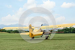 View of beautiful ultralight airplanes in field on autumn day