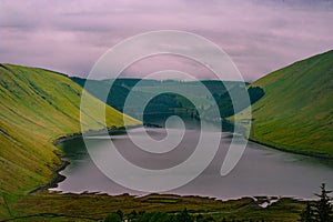 View of a beautlful lake Talla in Scottish borders with green hi photo