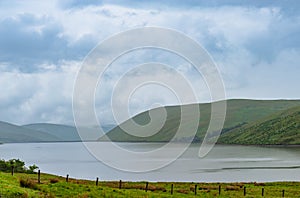 View of a beautlful lake Talla in Scottish borders with green hi photo