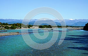 View from the bed of the Kodor river to the mountain peaks of the great Caucasus mountain range covered with snow