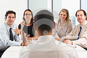 View From Behind As CEO Addresses Meeting