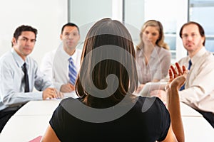 View From Behind As CEO Addresses Meeting photo