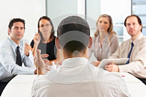 View From Behind As CEO Addresses Meeting photo