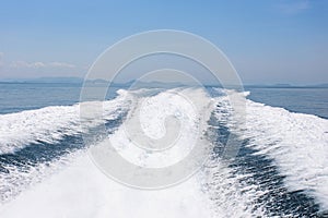 View behind the speed boat with sea and wave