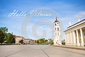 View of the bell tower and the cathedral of the Basilica of St. Stanislaus and St. Vladislav. Inscription hello Vilnius