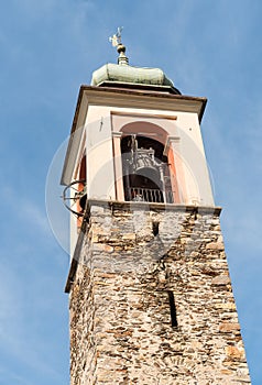 View of the bell tower of Church of Saints Peter and Paul (Santi Pietro e Paolo) in Vira Gambarogno, Ticino, Switzerland