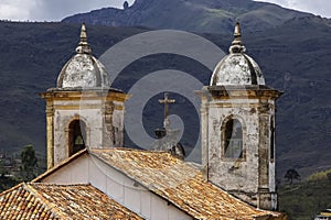 View of bell towers historic baroque church Igreja Nossa Senhora das Merces e Perdoes, and mountains, Ouro Preto, UNESCO World photo
