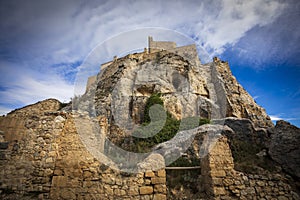 View from below of the imposing Morella Castle, CastellÃ³n, Spain photo