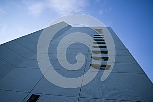 View from below of modern office building with sky above. wide angle shot of tall business buildings