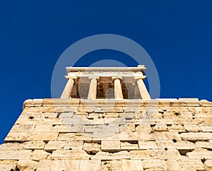 View from below of Temple of Athena Nike in Acropolis area of Athens, Greece