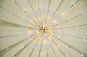 View from below of a wedding awning. Vintage retro lighting decoration