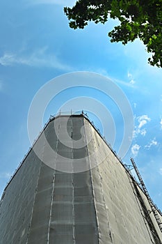 View from below of wrapped residential building for restoration