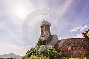 View from beneath to the historic Rocca of Radicofani Vintage photo effect Tuscany, Italy