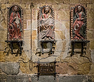 View of Biblia Sacra against a wall inside the Basilica of San Vicente, Spain photo