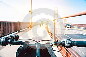 View from a bicycle at sunset on Golden Gate Bridge in San Francisco