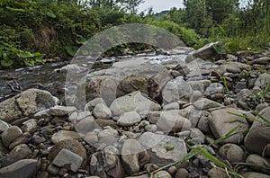 A view of Bieszczady Mountains, Poland, Europe - a stream and some stones.