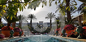 View from big blue outdoor pool on luxury hotel building