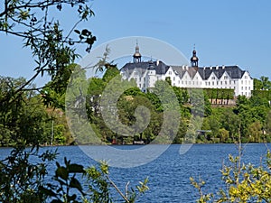 View of the big lake Ploen and the Ploen castle in Schleswig-Holstein, Germany photo