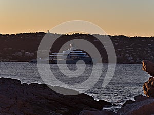 View of big luxury superyacht mooring in the Bay of Billionaires at the mediterranean coast of Antibes, French Riviera, France.