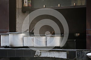 View of big utensils cooking in the restaurant kitchen