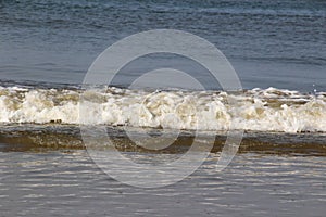 View on the big waves of the sea at the northern sea island juist germany