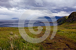 View from the bird cliffs on the ocean and clouds in Norway