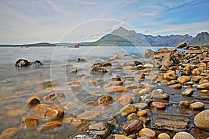 View of the Black Cuillin mountain range from the beach of Elgol across Loch Scacaig, Isle of Skye, Highlands, Scotland, UK