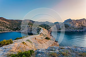 View of Black Sea bays with rocky shore lit with low sunrise light