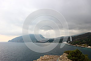 View of the Black sea and mountain Ayu-Dag Sleeping bear under stormy sky with clouds
